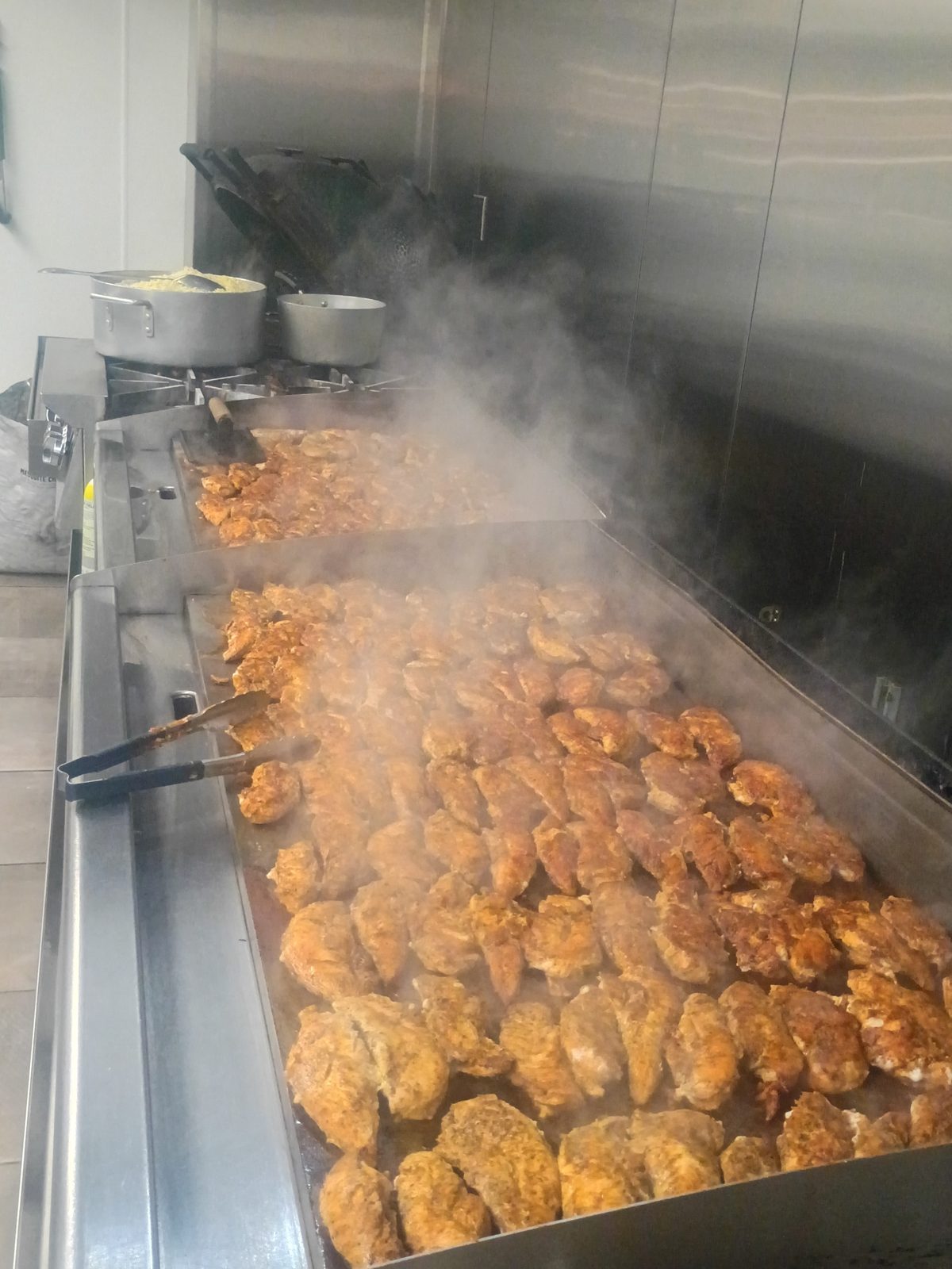 Seasoned chicken cooking on the Nine One Four griddle