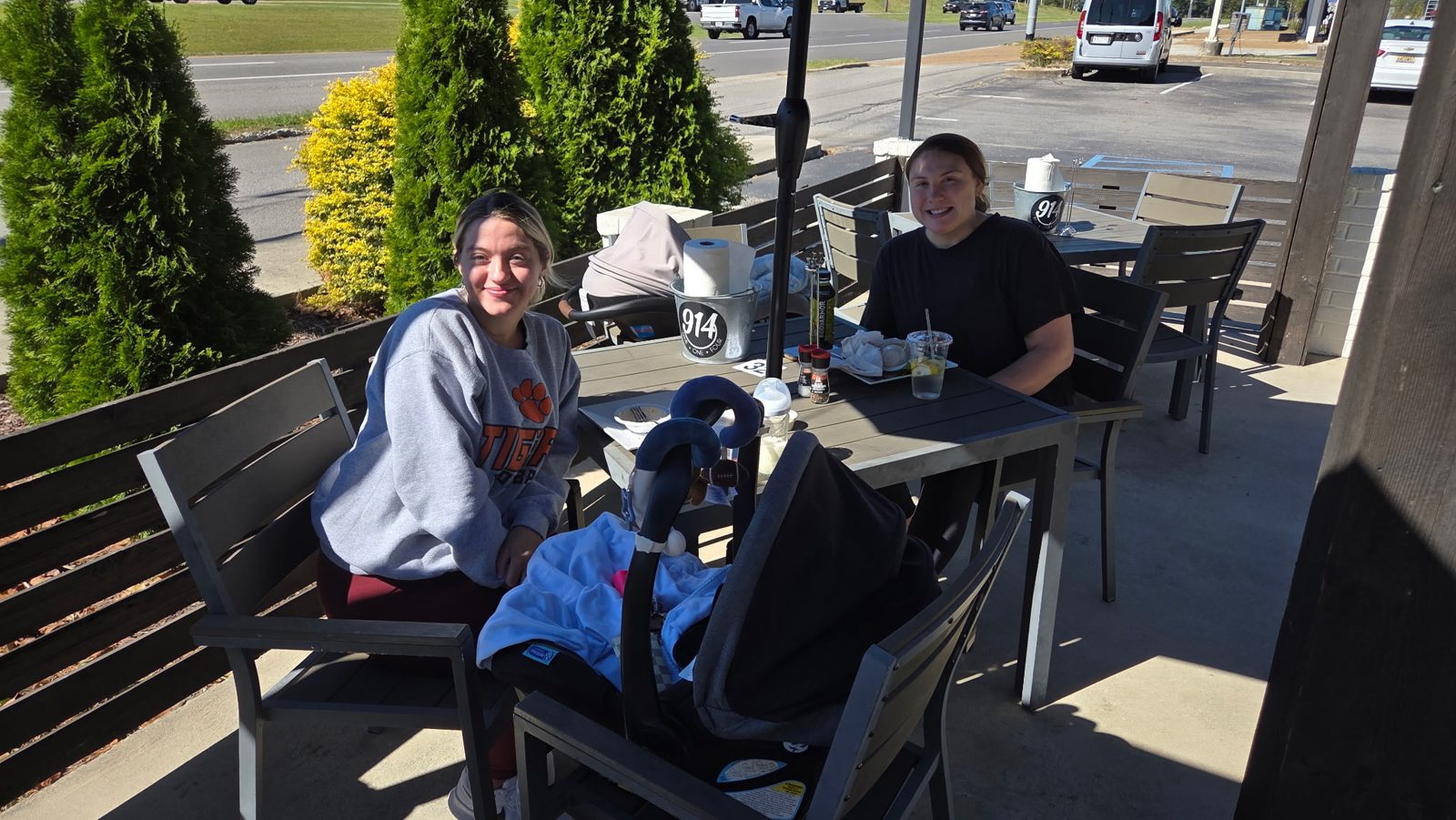 Two guests enjoying lunch on the Nine One Four patio